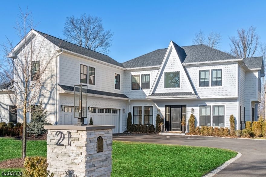 RARE TURNKEY OPPORTUNITY offering resort-style living, private backyard oasis, heated SALT WATER POOL with retractable cover, outdoor kitchen. smart home technology & designer-level interior. As a bonus the home is being offered FULLY FURNISHED, inclusive of professionally curated interiors, designer furniture, statement lighting, custom window treatments, & high-end extras.  Every detail has been thoughtfully executed  delivering a magazine-ready, perfect lifestyle. A grand foyer welcomes you to light-filled living spaces, high ceilings, wide-plank white oak floors, & architectural detailing. The main level is designed for effortless living, built-in bar, private office with custom desk, & a spacious family room with a direct-vent gas fireplace.  A first-floor guest room with en-suite bath offers privacy & comfort for guests. The chef's kitchen is a true showpiece, featuring Sub-Zero, Wolf, & Miele appliances, a dramatic quartzite island, walk-in pantry, & breakfast nook with bay window. Upstairs, the luxurious primary suite is a spa-like sanctuary with radiant heated floors, freestanding soaking tub, frameless glass steam shower & dual custom walk-in closets with private vanity. All bedrooms feature en-suite baths, complemented by a convenient laundry room & finished third-floor attic. The finished lower level with 10' ceilings, oversized gym, playroom, art room, performance stage, sauna, & a guest suite with egress window.   PERFECTION!!