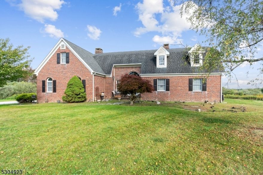 One of a Kind ANTIQUE BRICK Colonial with Cross County VIEWS!  Enter into the 2 story foyer to this 5 bedroom 2 and a Half bath Colonial that features Quartz Countertops in its huge country kitchen and stay warm there with the PELLET STOVE.  Step Out from the Kitchen to the open PORCH and take in the VIEWS.  Powder Room and Laundry/Mudroom off the kitchen create great convenience along with the pantry and what seems to be endless closet space throughout the home.  HARDWOOD Floors run throughout the 1st Floor which also features the living Room with fireplace, Cathedral Ceilings, Mountain views and additional sliding doors to back yard and porch.  Step into the 1st floor spacious Primary Suite that features, FIREPLACE, hardwood floors,  Walk In Closet and full on suite bathroom.  The 2nd bedroom/Office on the first floor provides great options for use.  Walk up to the 2nd Floor and find 3 more Bedrooms, Full Bath, a Foyer Landing overlooking both the living room and front door Foyer with bonus views from there through the huge picture windows.  Not enough space yet?  Finish the Additional Space above the 2 car garage!  Head to the partially finished basement to find space for not only storage but possible rec room/den/family room.  Come see for yourself just how special this home is.