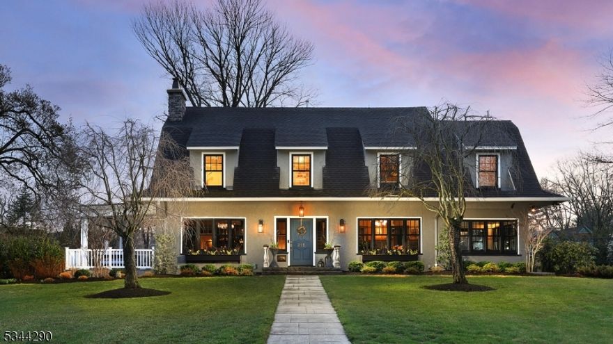 This iconic and grand Center Hall Dutch Colonial offers over 5,000 sq ft of completely reimagined living space in one of Cranford's most prestigious neighborhoods. Set on a beautifully landscaped .80-acre lot, the property features two patios ideal for entertaining or quiet relaxation. A full-scale designer renovation blends timeless architecture with modern luxury restored and new hardwood floors, three gas fireplaces, and exquisite finishes throughout. The chef's kitchen features a 10-ft black limba island, Thermador appliances, custom beams, and a butler's pantry. The kitchen overlooks the separate dining area and spacious family room, and leads to a first-floor BR (used as an office) and a full Bath. The mudroom offers plenty of storage and a convenient stacked laundry center. A dramatic grand staircase anchors the elegant foyer, setting the tone for the home's sophisticated design. The sunroom opens to the patio, while the formal living room showcases a bespoke mahogany bar with brass detailing. The current music room can easily be used as a formal dining room. Upstairs, the primary suite includes dual walk-in closets and a spa-like bath. Spacious additional BRs feature a shared bath, plus a full second-floor laundry room. The finished third floor offers a private BR, full bath, and a bonus sitting room. Equipped with Tesla Powerwalls, solar panels, Sonos sound, and more this rare opportunity is just two blocks from Downtown shopping, restaurants, and NYC transportation.