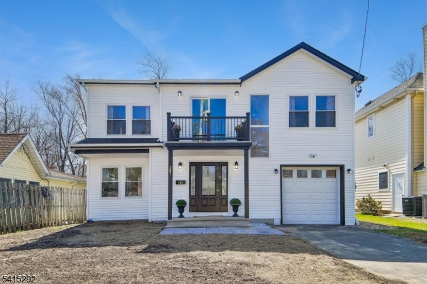 Completely rebuilt on an expanded foundation in 2026, this like-new home offers modern construction, clean design, and turnkey living. New HVAC, roof, and siding are paired with hardwood floors throughout, creating a cohesive, move-in ready interior. The main level features a spacious living room, formal dining area with sliding doors to a large deck, a well-scaled powder room, and a modern kitchen with white cabinetry and quartz countertops. Upstairs offers four generously sized bedrooms, including a primary suite with two walk-in closets and a private bath. One secondary bedroom includes a walk-in closet, while another opens to a private balcony. A full hall bath and second-floor laundry complete the level. Additional features include a one-car garage, 2 car driveway, and a flat, fully fenced backyard with both patio and deck for outdoor use. Convenient access to major transportation, shopping, and daily essentials.