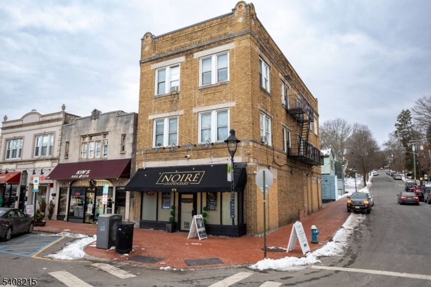 Prime mixed-use investment in the heart of Maplewood Village. Welcome to 171 Maplewood Avenue, a rarely available, fully leased corner property located at the highly visible intersection of Maplewood Avenue and Highland Avenue. This well-maintained building offers a strong blend of stability, upside potential, and location in one of New Jersey's most desirable downtowns.The property consists of one ground-floor commercial space with excellent frontage and signage opportunity, along with three residential apartments above, creating a diversified income-producing asset. The residential component includes two one-bedroom units and one three-bedroom unit, all occupied by long-term tenants.Additional highlights include private rear access, basement storage, excellent foot traffic and exposure alongside popular neighboring businesses, and on-street plus nearby municipal parking. Zoned in an area that allows for potential vertical expansion, subject to approvals.Situated in the affluent and walkable Maplewood Village, this thriving live-work-play environment attracts steady foot traffic from locals and visitors alike, with a strong mix of boutiques, cafes, and convenient NJ Transit access. An ideal opportunity for investors seeking stabilized income with future upside or owner-users planning for future occupancy.