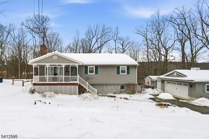 Welcome to this spacious 3 Bedroom, 2 Full Bath Raised Ranch that is just a short walk to the Barry Lakes clubhouse & lake. This home offers the perfect blend of comfort, space, and lifestyle. The main level features a custom kitchen with granite countertops, abundant cabinetry, and a center island, seamlessly flowing into the adjoining Great Room with soaring cathedral ceilings, stunning wood detail, and walls of windows that flood the space with natural light. A cozy wood burning fireplace anchors the room, while sliders lead to a brand new Trex deck overlooking the fully fenced yard   ideal for entertaining and easy outdoor access. The finished lower level adds exceptional versatility, complete with a gas fireplace, second full bath, dedicated laundry room, garage access, and a spacious utility/storage area. Additional highlights include: 1 Car Attached Garage, Detached 2-Car Garage (bonus storage/workshop potential), Off-Street Parking, Fully Insulated Attic, New Well Pump. Enjoy year-round lake community living with space, warmth, and thoughtful upgrades throughout.