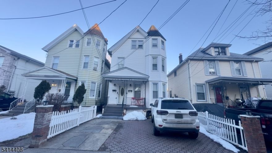 Great investment opportunity or perfect owner-occupied home! This well-maintained 2-family property offers spacious layouts in both units. The 1st floor features a living room, dining room, kitchen, 1 bedroom, 1 full bathroom, hardwood floors, and access to a deck. The 2nd floor includes a living room, dining room, updated kitchen, 3 bedrooms, and 1 full bathroom. The finished basement provides additional living space with a family room and office. Separate utilities for each unit. Conveniently located near transportation, shopping centers, and schools.