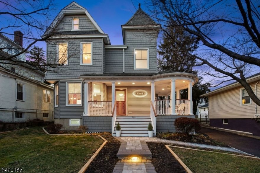 Welcome to this pristinely maintained 4-bedroom, 1.5-bath home which features a beautifully restored wraparound porch, a hallmark of 1880 Lambert homes. The renovated interior combines historic character with thoughtful modern updates. Inviting entry foyer has original woodwork and balusters, leading to the light-filled living room and dining room with oversized windows and high ceilings. Period details abound, including chestnut trim, hardwood floors, classic moldings and woodburning fireplace with original mantel. Modern, stylish kitchen features white cabinetry, quartz countertops, a subway tile backsplash, and stainless-steel appliances complemented by a radiant-heated tile floor. New laundry room is off kitchen with a stacked washer/dryer and skylight. Kitchen also has direct access to small porch, paver patio, and a spacious backyard perfect for relaxing or entertaining. Upstairs, all bedrooms feature large windows, generous closets, and refinished hardwood floors. The office is easily converted to a bedroom. Main bath was recently renovated with a stall shower. Additional updates include a new hot water heater and numerous new thermal windows. Walk-up third floor provides flexible space that can be used as a home office, playroom, or guest suite. Exterior highlights include vinyl-shake exterior, Trex front steps, paver walkway, large private backyard and newly paved driveway. The large, unfinished basement offers tremendous potential for future finishing.