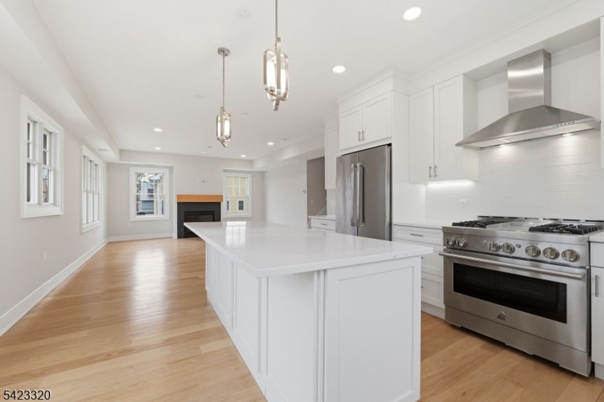 New Construction    Assigned Garage ParkingBe the first to live in this beautifully crafted new construction townhouse offering high-end finishes, a spacious open layout, and the modern lifestyle today's renters are searching for. This stunning 3 Bedroom / 2.1 Bath home features soaring ceilings, oak hardwood floors throughout, abundant natural light, and exceptional attention to detail.The designer chef's kitchen is built to impress with custom soft-close cabinetry, quartz countertops, oversized center island with seating, premium stainless steel appliances, and a JennAir gas range. The kitchen opens seamlessly to the dining area and large living room with a gas fireplace, creating the perfect space for everyday living and entertaining.The main-level primary suite offers privacy and convenience, complete with a luxurious ensuite bath featuring dual vanities and a glass-enclosed shower. Two additional bedrooms are located upstairs along with a beautifully finished full bathroom.Additional features include two-zone central air and heat, Pella windows, HardiePlank and cultured stone exterior, and a welcoming entry foyer with mud room space.Located just minutes from downtown Summit, NYC train, top-rated schools, parks, dining, shopping, The Mall at Short Hills, and Overlook Medical Center. Rare opportunity to rent a luxury townhome in one of Union County's most sought-after locations.