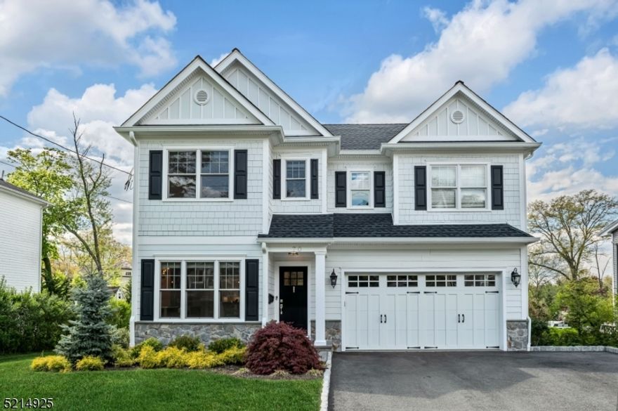 Exquisite home in the heart of Chatham Boro, close to the train station & schools. Built in 2020 by S. DeMarzo & Sons, with a strong reputation for quality, this home features an open layout, high ceilings, & detailed moldings. The kitchen features white cabinets, contrasting island with built-in wine fridge, quartz countertops, & a six burner range plus a second wall oven & microwave. The family room boasts a coffered ceiling, large picture window, & gas fireplace. Elegant "bar room , with custom built-ins & beverage refrigerator, dining room, mudroom, & powder room. Primary suite with large windows, tray ceiling, two walk-in closets, & en-suite bathroom with spa-like shower, large soaking tub, two-sink vanity, & separate toilet room. The second floor has three additional bedrooms with en-suite bathrooms & a full laundry room. Finished lower level with a bedroom, full bath, large recreation space, & storage. Two car garage with epoxy floor, built-in storage, & electric vehicle charger. Level backyard with a spacious deck & patio surrounded by privacy hedges.