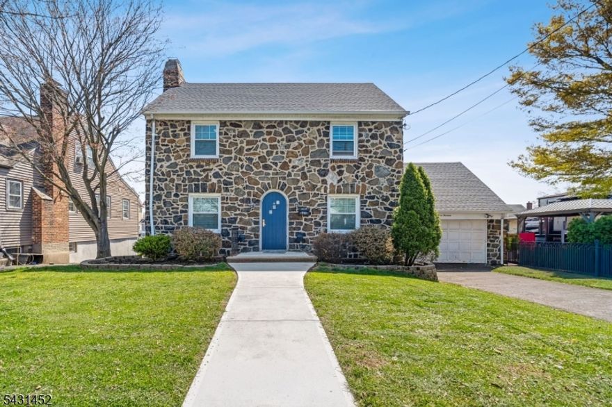 Welcome to this beautifully updated Colonial-style home in the heart of Linden, offering the perfect blend of charm, space, updates, and convenience. Featuring 3 spacious bedrooms, 2.5 bathrooms, a bonus bedroom in the basement, and an additional den off the main living area perfect for a home office or flex space.Major updates have already been taken care of for peace of mind, including an updated kitchen completed in 2022, a brand new roof installed in 2022, energy-efficient solar panels to help save on utility costs, a newer water heater, brand new sewer line, and a new bathtub backed by a lifetime warranty.The stunning stone exterior adds timeless curb appeal, while the impressively large backyard creates the perfect setting for entertaining, summer gatherings, pets, gardening, or simply enjoying outdoor space rarely found at this price point.Perfectly located just minutes from Linden Train Station with direct access into NYC, this home is a commuter's dream while still offering a suburban neighborhood feel. Shopping, dining, parks, and major highways are all within five minutes, with Warinanco Park just two blocks away, making everyday convenience effortless.