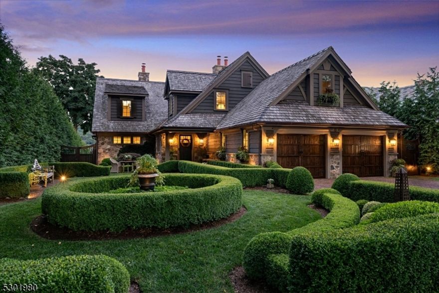 Lake Mohawk - Manitou Island English Inspired lakefront with manicured boxwood gardens and brick paths.  Completely renovated in 2018, 25 Island Trail blends timeless and tasteful design elements and all the necessary amenities needed to create a cohesive and inviting home.  Solid oak flooring, marble bathrooms, soaring ceilings, natural stone two story fireplace with reclaimed wood mantle, ceiling beams, custom lighting fixtures, designer window treatments and wallcoverings,  high end appliances, custom cabinetry and natural stone countertops throughout.  First floor primary suite offers a serene retreat, with french doors leading to deck, and a luxurious ensuite bathroom with custom cabinetry, marble tiles, and an oppulent dressing room and closet. New mechanicals, windows and doors. All NEW exterior features are:  cedar roof, cedar siding, composite decking (including 50' deck with pergola), 44' bluestone covered patio, stone retaining walls, irrigation system, landscape lighting, extensive landscaping, brick driveway and front walk and infinity edge gunite spa with waterfall.  Boathouse with new sun deck.  Renovations and system upgrades on file.  Enjoy all the amenities Lake Mohawk has to offer all year round! Boating, fishing, swimming, water sports, and private dining.  Experience the ultimate lakeside lifestyle at 25 Island Trail...just 50 minutes from NYC.