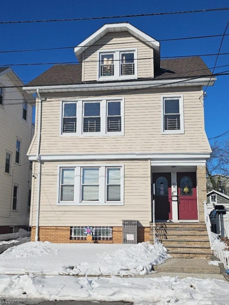 Updated second-floor apartment with a renovated eat-in kitchen featuring granite countertops, updated bath, and laminate/hardwood flooring. Includes 3 spacious bedrooms plus bonus office space. Prime commuter location near highways and public transit. 1 rear parking space included.