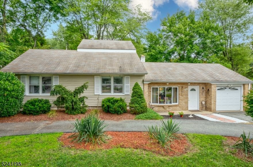 Move-in ready 3 bedroom, 2 bathroom custom home with pool. Located in the desirable Pine Brook section, this updated home offers an open and flexible floor plan. The home welcomes you into a large living and dining space with a wood-burning fireplace. From there, enter the eat-in kitchen with a large peninsula that opens to the family room with cathedral ceilings and a slider to the large deck. The main level offers an updated full bathroom, a primary with updated en-suite bathroom and two additional bedrooms. From the family room there are stairs up to a large loft with hardwood floors, ideal for an office or guest space. Outside is a stunning retreat with a large deck, overlooking a 20x40 in-ground pool with new liner. The large, fenced, nearly half acre lot offers privacy and plenty of space for entertaining. There is a one-car garage and convenient circular driveway. Great schools, close to major highways as well as public parking for the NYC bus, this home is not to be missed.