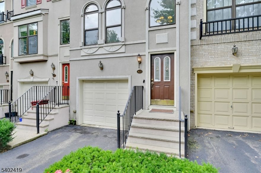 Luxury, Location & Lifestyle - All in One! This beautifully updated 2BR, 3.5BA townhome in the sought-after gated community of Cambridge Heights at Nutley blends comfort, style, and convenience in a secure, amenity-rich setting. This home is approx 2000 square feet and features high ceilings, fresh neutral grey paint, and desirable double exposure creating a bright, inviting atmosphere. The finished basement offers a spacious family room with fireplace, a full bath, and direct access to the tiled garage and private tiled patio - perfect for outdoor dining or relaxing. The first floor features a large living room with hardwood floors and fireplace, an updated kitchen with granite counters, stainless steel appliances, modern finishes, ample cabinetry wiht under lighting, and newer appliances including a BRAND NEW gas range oven!! A formal dining room overlooks the front and is adjacent to the kitchen; closets and a private powder room complete this level. Upstairs are two bedrooms, including a primary suite with a renovated bath featuring an oversized walk-in shower with bench and shower system; a second bedroom, and full bath w/shower/tub, and laundry area complete this floor. Recent upgrades include updated mechanicals and fresh paint. Enjoy gated security and resort-style amenities: pool, clubhouse, tennis courts, and playground. Minutes to shopping, dining, parks; 2 minute walk to NYC local bus; 7-minutes to Express NYC bus.Front Door is North Facing FOR COMP PURPOSES ONLY