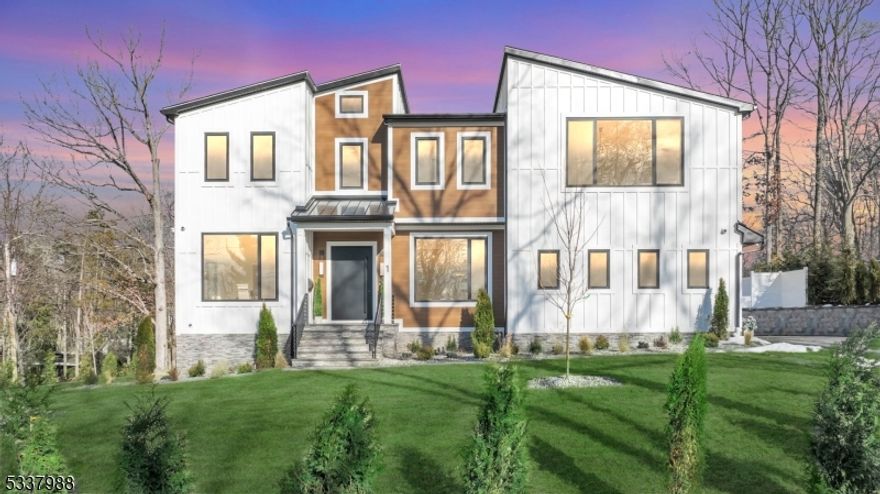 Nestled on a peaceful cul-de-sac in the desirable section of Short Hills, this modern new construction  residence seamlessly combines elegance, warmth, and state-of-the-art amenities. The backyard is a private oasis, complete with a stunning gunite smart saltwater pool, covered porch, private balcony & a generous deck surrounded by lush landscaping. 1 Barry exudes refined style with soaring 20ft ceilings,  oak hardwood flooring, and custom modern doors. The European custom  expansive windows allows natural light to flood the open-concept living spaces. The  premier gourmet kitchen features designer light fixtures, 13ft marble island, custom white oak cabinetry, and Thermidor appliances, including double ovens and a massive sized refrigerator. The separate prep kitchen features a  Thermador fridge & microwave/oven combo. The home offers 7 spacious bedrooms, each with its own luxurious en-suite bathroom and unique accent walls. The primary suite serves as a personal retreat with a cozy lounge, private balcony & a spa-inspired bathroom. The fully finished entertainment  level includes 9ft ceilings,  a family room with a fireplace, a second kitchen with a smart fridge, a secondary laundry room, and en-suite accommodations. Outfitted with an advanced security system, Legrand  outlets,  robust 300-amp electrical system, EV charger & Bluetooth connectivity  this home provides unparalleled convenience, security & privacy in one of Short Hills' most coveted locations.