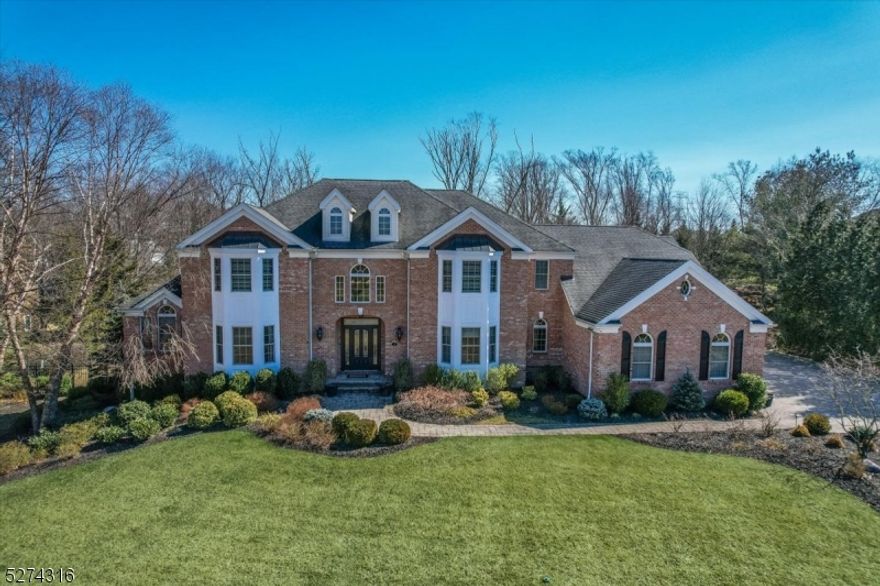 Exquisite brick Colonial situated on .93 acres of PRIVATE & PICTURESQUE views within sought-after Hanover Twp,known for LOW taxes & great schools. Exquisitely updated throughout 3 finished flrs providing over 6,400sqft. 5 Bedrms, 5.1 baths, 3 car garage, an incredible finished Walkout LL & an extraordinary outdoor oasis, you will never want to leave. Enter into an impressive 2 story foyer w/a graceful curved staircase, upgraded millwork, oversized windows & H/W flrs. The elegant living rm leads to a lovely sunrm & library/office w/french drs for privacy. A formal dining rm joins to the expansive chef's kitchen w/custom cabinetry, quartz counters, spacious center island w/seating & high-end SS appliances, a sun-filled breakfast area that transitions to the cozy family rm w/built-in cabinetry & stone FP. The primary suite is a large, light-filled private retreat, complete w/a spa-like bath & a dressing area w/2 large walk-in closets. The upper level has a beautiful open landing & 4 other large suites. The FABULOUS finished LL is complete w/wet bar, home theater, gym, full bath, entertainment area, 2nd laundry & more. The lavish outdoor retreat has everything you could want! Built-in kitchen w/prof appl, heated gunite pool, hot tub (saltwater), a waterfall, multi-level paver patios, pergola, retractable awning, powered shed all ensconced by beautiful landscaping & total privacy. The home is wired w/built-in sonos system inside & out, security cameras & whole-house generator.