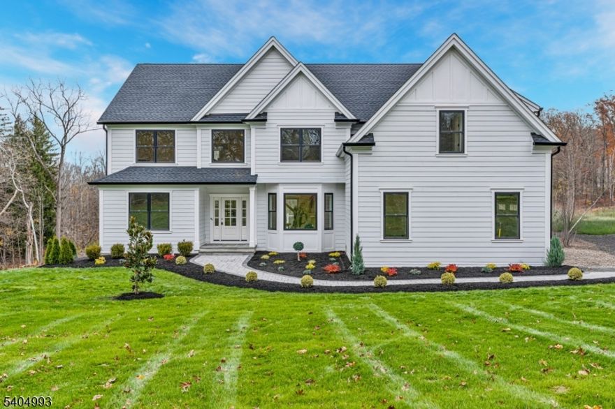 Welcome to 65 Old Forge, where inspired design meets meticulous craftsmanship in this exceptional new construction residence offering 5 beds and 5.1 baths. Thoughtfully designed for modern living, this home strikes the perfect balance between luxury and functionality. The open-concept floor plan features soaring ceilings, intricate millwork, HW floors, and custom moldings throughout. The kitchen showcases quartz countertops, an oversized center island, Thermador appliances, pantry, and custom cabinetry. Flowing seamlessly into the FR, where a gas f/p creates a warm and inviting space for everyday living and elegant entertaining. A formal DR with a butler's pantry and stunning moldings adds timeless sophistication. Practical luxury continues with a 1st ensuite bedroom, ideal for guests or flexible space. Upstairs, the primary is a private retreat featuring vaulted ceilings, dual walk-in closets, and a spa-like bath with dual vanities, soaking tub, and oversized stall shower. Three add'l bedrooms, each w walk-in closets, 2 full baths and a spacious laundry room complete this level. The LL with 9' ceilings expands the living space with a rec room, full bath, storage, and walk-out access. Add'l highlights: Hardie Plank siding, Andersen windows, composite deck, EV-charger pre-wiring, new poured concrete foundation and a level backyard offering abundant space for enjoyment. Built for comfort and efficiency where quality, style, and modern convenience come together.