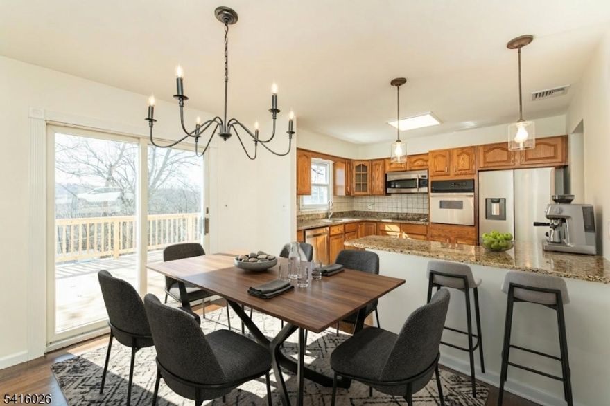 Welcome to your move-in-ready retreat; beautifully updated and thoughtfully maintained! This 4-bed, 2.5-bath home impresses with newly refinished hardwood floors and an updated kitchen featuring granite countertops, a brand new refrigerator, quality cabinetry, and pantry storage. A separate bright dining area fills the main floor with natural light from the sliders to the back deck. The spacious primary suite includes two closets and a private bath, while the main bath offers the comfort of radiant heated floors.The lower level provides a generous family room with a stacked-stone fireplace (new hearth 2023), new slider, laundry room with a half bath, and a versatile fourth bedroom. Enjoy an oversized garage with new doors and a generator hook up! The private backyard is fully fenced and has a shed and Jacuzzi hookup; perfect for entertaining or relaxing!Major upgrades include a new septic system, new central air, paver sidewalk, water softener, and hot water heater (all 2023). Ideally located near Seneca Lake, Byram and Sparta?s shops, restaurants, and commuter routes. Central vac and fireplace to convey as-is. Don?t miss this exceptional home that blends modern comfort, style, and convenience!