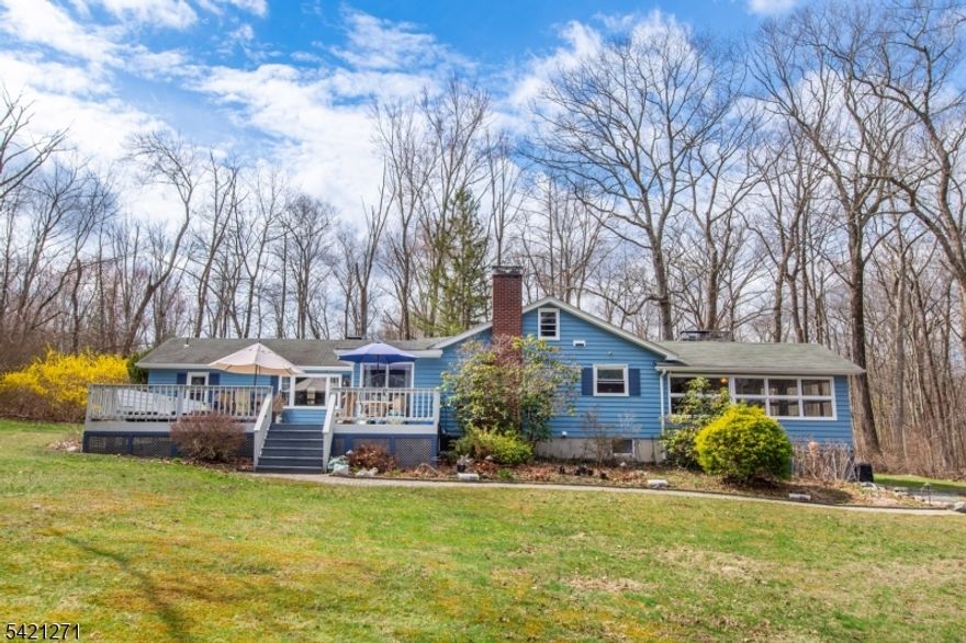 This beautifully updated 3 bedroom, 2 bath home is nestled in the charming community of Branchville and backs directly onto Culver's Creek, a state stocked trout stream, offering a serene setting with private access for trout fishing. Conveniently located just minutes from local amenities, this home blends tranquility with accessibility.Extensively renovated, the interior and exterior have been recently repainted, creating a fresh, modern feel. The home features three fireplaces, two with wood burning stoves and one in the dining room, adding warmth and character throughout.The layout offers a seamless flow, enhanced by built ins in three rooms. The kitchen includes stainless steel appliances, while upgrades feature a new main breaker panel, repointed chimneys, and all new LED recessed lighting with dimmers, updated switches, outlets, and select USB ports. A full house generator provides backup power, and a security system adds peace of mind. Stained glass fixtures add unique charm.The dining room showcases hardwood floors with inlays and views of the deck and yard. The living room features a stone fireplace, built ins, and a large picture window. Both bathrooms are updated, and bedrooms offer generous storage and scenic views. A cozy den with new carpeting and a stone fireplace adds extra living space. The expansive, lighted deck is perfect for relaxing or entertaining while enjoying the beautiful, estate like property. Sale Includes 2 lots with 2 car detached garage.