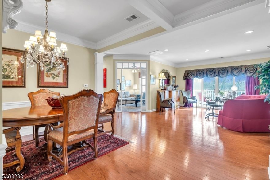 Step into this spacious TOP-FLOOR 2 bedroom, 2 full bath condo in the desirable Somerset Run 55+ gated community, offering bright southern exposure and a spacious, open layout. Beautiful hardwood floors flow through the main living areas, with carpeting in the bedrooms and versatile den. The eat in kitchen features upgraded 42" cabinetry, granite countertops, a modern backsplash, and stainless-steel appliances. The second bedroom includes a custom built in cabinet for added storage. The primary en suite offers a tray ceiling, double sink vanity, and a generous walk-in closet with California style organizers. Both bathrooms feature elegant faux paint finishes. Enjoy the outdoors on the 7'x14' covered balcony overlooking the woods, complete with outdoor storage. A 5' x 8' indoor storage room is conveniently located on the same floor, and the unit includes one assigned space in the underground garage. Somerset Run residents enjoy a 25,000 sq. ft. clubhouse, indoor/outdoor pools, fitness center, tennis, pickleball, bocce, and numerous clubs and activities. HOA includes water, garbage, and full clubhouse amenities. Easy access to Rt 287, close proximity to hospitals, food shopping and retail stores.This top floor gem combines style, comfort, and resort style amenities ready to welcome its next owner.