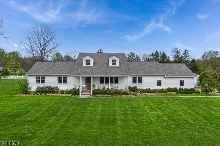Welcome to a truly exceptional opportunity in the coveted Far Hills section of Chester Township. A private 5-acre estate awaits, offering the rare chance to own a turnkey horse farm or create your own luxury retreat. Set behind a gated driveway on a private road, this fully renovated, expanded ranch blends modern elegance with timeless country living. Featuring 5 bedrooms and 3 full baths. A sun-drenched, open-concept layout showcases a designer kitchen with a dramatic center island, new appliances, and seamless flow into the family room w/ a wood-burning fireplace. Sliding doors open to the back for effortless indoor-outdoor living. Hardwood floors, updated lighting, and polished finishes elevate every space. Formal living and dining rooms add classic appeal, while a mudroom off the oversized two-car garage adds everyday ease. The first floor primary offers a wall of windows overlooking the grounds.   One bedroom has been transformed into an oversized walk-in closet. A fully finished basement provides flexible space for a gym, media room, or recreation. Outdoors, enjoy fully fenced acreage with a  3 stall barn, 2 horse paddocks, in-ground pool, and front porch with swing. The home has been thoughtfully updated, including a new septic (2020) roof, siding, and windows(2021). A pool house with architectural plans for expansion adds even more potential.  A rare offering with endless possibilities. Horses not included!  Barn, pool house and pool  are "as is" w/ no known issues.