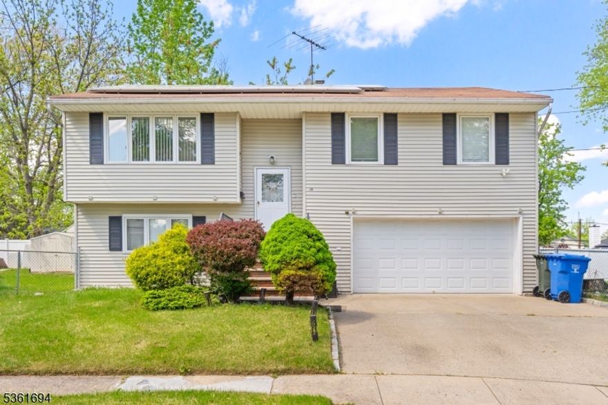 Impeccably maintained 4 BR 2 Bath Bi-Level home. Nestled in a desirable neighborhood, quiet, cul-de-sac lot. This charming property boasts 4 spacious bedrooms to amaze with 2 full baths. Features upstairs include an open and airy floor plan and beautiful hardwood floors. Vaulted ceilings in the living room and dining room. Fully equipped eat-in kitchen features breakfast bar, granite counters ceramic backsplash, recessed lights and ample cabinets space. Step downstairs to find an oversized family room with 2 skylights, well-sized bedroom and full updated bathroom- stylish and functional, designed for comfort. Sliding door that leads to a private fully fenced backyard, the perfect space for entertaining, gathering, BBQ, or quiet mornings with coffee... the possibilities are endless. Enjoy the incredible location, providing convenient access to all the amenities and attractions of Colonia. Additionally, the NYC bus top is just a few blocks away. Prime location!