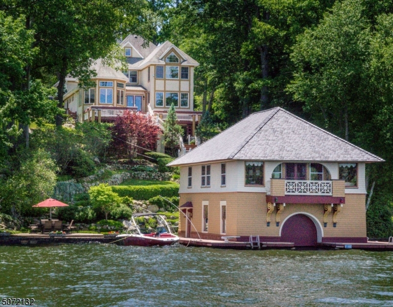Move right into this spectacular TURNKEY waterfront estate & boathouse "ROSSMORE" lakefront living at it's best. Swim, Sail, Boat, Fish in beautiful Davis Cove.Trains & Buses nearby, 1 hr. from NYC! Artfully uniting today's modern luxury & grandeur of the past. This spacious home features open LR, DR, Family Rm, Kitchen, 3 Bedrooms, Loft, Office & Laundry in main house. Living room features stone fireplace, coffered ceiling & hardwood floors. Gourmet kitchen w/island & upscale stainless appliances.  Finished lower level features TV Room/Gym, Wine Cellar, Workshop, Storage & Walk-out. Multi-level deck, multi-sport court, outdoor dining areas & lush landscaped yard. Seasonal boathouse features 3 Bedrooms, LR, Kitchen, Bath, Storage, Indoor & Outdoor Boat lifts. Drive your 4-Wheeler/Golf Cart down to the water.