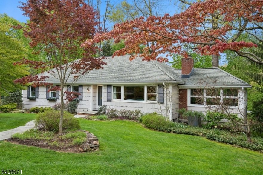 This meticulously maintained 1960's ranch is tucked away on a quiet cul-de-sac in the sought-after Tall Oaks section of New Providence. Thoughtfully updated and move-in ready, the home offers an abundance of natural light and an inviting layout. The Living Room is bright and welcoming, while the adjoining Den adds character with a wood-beam vaulted ceiling. The Kitchen is functional, featuring high-end stainless steel appliances, granite countertops, and direct access to a spacious deck overlooking the beautifully landscaped backyard. Three generously sized Bedrooms include a Primary Suite with an En-Suite Bath. The finished walkout lower level offers additional living space, Mudroom, Laundry, Storage, and access to the oversized 2-Car Garage. The outdoor patio is ideal for dining and entertaining, complete with a pergola and built-in grill. Don't miss the separate bonus room, accessible exclusively from the exterior off the patio- perfect for a gym or office. Fireplace, chimney, flues, and grill in "as-is  condition.