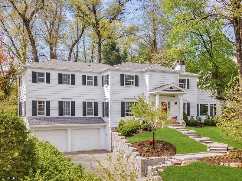 Majestically set on 0.6 beautifully landscaped acres, this sun-filled gem offers 6 BD, 4.2 BA, the ideal open floor plan for easy living & entertaining, a WOW kitchen family room combo & privacy... all in one of the most desirable neighborhoods in Short Hills! Welcoming 1st FL w/ light & airy living rm, dining rm, spacious guest suite & office/6th BD. Gourmet kitchen w/ 6-burner range, lg center island, & tons of storage & prep space opening to family rm & breakfast rm leading to expansive bluestone patio & yard. 2nd FL w/4 beds, incl master w/dressing rm, walk-in closet & bath w/steam shower. 2 add'l baths on 2nd level. Partially fin LL, w/ rec room & mudroom.  HW floors, security system, perennial gardens, irrigation system. Across from Old SH Park. SUCCESSFUL 2019 TAX APPEAL - TAXES WILL BE REDUCED.