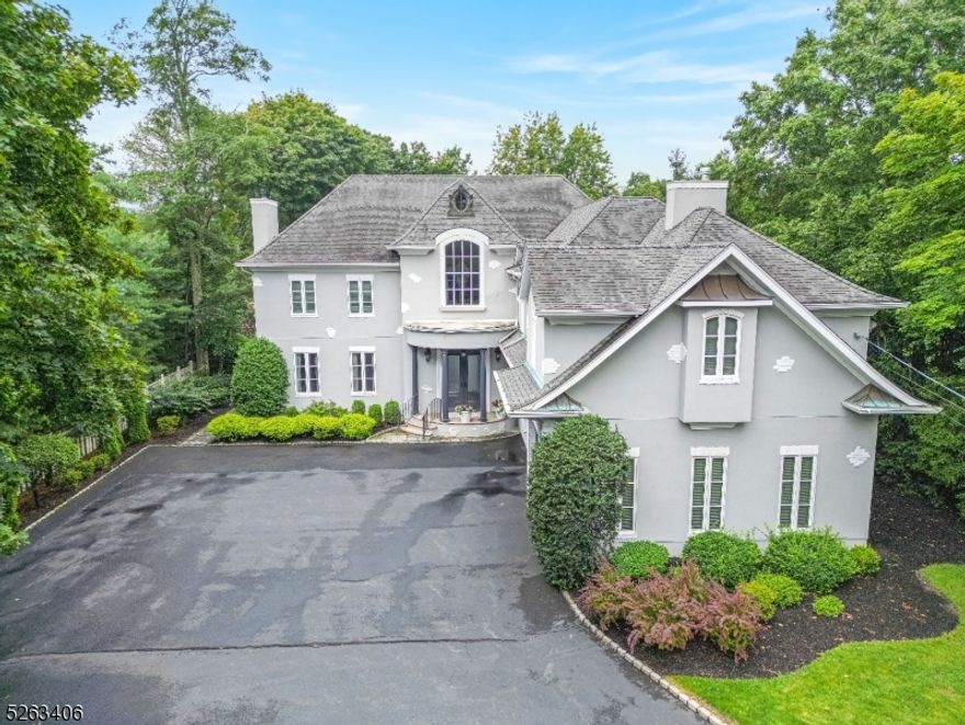 Prestine Center Hall Custom Colonial offers approx. 5400 SF of unsurpassed quality, style & curb appeal built for large scale entertaining both inside & out.Layout begins with a inviting marble foyer with an impressive flow & design including 10' ceilings on the main level.Formal Living Rm w/ FPL,Banquet sizeFDR.Designer kitchen(2017) features professioial grade appliances, custom cabinetry & esqisite Quartz counter tops.Stunning sun drenched  GRT RM w/dramatic stone fireplace & w/flloor to ceiling windows.Private library checks the box for all whom work from home.Tranquil owners suite, LUXE bathroom(2016), duel FPL and HUGE CUSTOM walk in closet.Two bedroom en-suites plus 2 additional bedrooms w/Jack n Jill FBTH. Just finished walk out LL offers endless options.Resort style rear property offers, Gunite pool(2023),outdoor kitchen ,basketball area & much more.Elevator,Generator,finished 3 car heated garage,high ceiligs throughout & sooo much more.Hurry this one will not last!