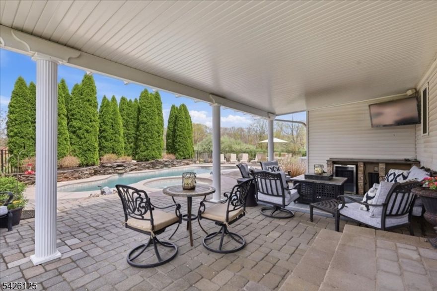 This is the one you've been waiting for. Immaculate 4/5 bedroom, 2.1 bath colonial backing to preserved farmland for exceptional privacy and serene, open views poistioned in a quiet cul-de-sac neighborhood where homes rarely come to market.Designed for both everyday living and effortless entertaining, the spacious family room with fireplace flows seamlessly to a true resort-style backyard featuring a heated in-ground pool with spa, outdoor kitchen, and covered porch perfect for summer gatherings or relaxing evenings at home.The versatile first floor offers a welcoming living room, formal dining room with custom built-in cabinetry, and a beautifully updated eat-in kitchen with breakfast bar. A flexible office or guest bedroom, powder room, and laundry/mudroom add convenience and flexibility to fit today's lifestyle.Upstairs, the primary suite features generous closet space and a spacious private bath, along with three additional well-sized bedrooms and a pristine hall bath.The finished basement provides additional living space ideal for recreation, media, or a home gym, plus ample storage.Enjoy the best of both worlds a peaceful, country-like setting just minutes from major highways, shopping, and everyday conveniences in desirable Whitehouse Station.Homes like this rarely become available don't miss your opportunity.