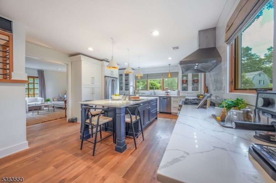 FULLY RENOVATED MODERN-DAY MASTERPIECE W/ BEAUTIFUL GARDENS STEPS FROM NEW PROV TRAIN STATION! This fully renovated colonial has 3 bds on the 2nd level PLUS a fully finished 3rd lvl which is easily a 4th bd/office AND a finished LL w/ access to the backyard. Every detail thoughtfully crafted, this cedar-clad home brings together the perfect mix of contemporary style & warmth. Outside a gardener's paradise awaits, ripe w/ perennial gardens, fruit trees, winding walkways, & a grapevine arbor. Open FP, crisp white walls, incredible natural light & wide-plank white oak floors bring a sense of peace & calm. Spacious & bright Living Room invites entry from Front Porch, both w/ steel accents. The open Dining Room & expansive Chef's Kitchen continue to impress w/ custom cabinetry, windows w/ three exposures, modern brass sputnik chandelier, massive island w/ prep sink, SS appliances including 48-in. gas Z-line convection range & Bosch dishwasher, plus room for a wine fridge under the custom-designed wood & steel staircase. Family Room sits beside the gorgeous kitchen w/ views of the winding creek through French doors. Full Bathroom rounds out 1st Level. 3 spacious Bedrooms, including Primary Ensuite are the highlight of the 2nd Level w/ Laundry Closet & additional Full Bath. Bright 3rd Level is the perfect Studio, bonus Bedroom or Rec Room w/ windows & half Bath. The real showpiece is the garden with flowering perennials, fruit trees, raised beds & grapevine arbor. Don't miss this!