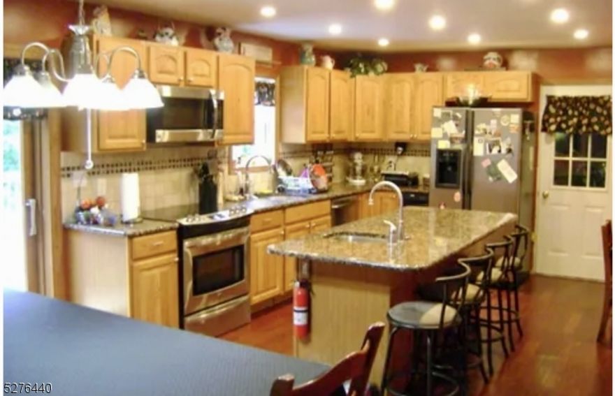 (IN-LAW SUITE) CLASSIC CENTER HALL COLONIAL NESTLED IN THE COMMUNITY OF LAKE PANORAMA! HIGHLIGHTS INCLUDE A GRANITE KITCHEN WITH STAINLESS STEEL APPLIANCES & BREAKFAST ROOM THAT INVITE YOU TO LINGER OVER YOUR MORNING'S COFFEE AS YOU GAZE OUT AT YOUR PRIVATE, PARK-LIKE PROPERTY! LEMONADE FRONT PORCH, NEWER ROOF, WOOD BURNING FIREPLACE, 2 TIERED DECK, PELLET STOVE, HARDWOOD FLOORS & A SPACIOUS IN-LAW SUITE ROUND OUT THIS CUSTOM HOME! SQUARE FOOTAGE DOES NOT INCLUDE THE FINISHED WALK OUT ADDING APPROXIMATELY 1200 ADDITIONAL SQAURE FEET! *CHIMNEYS AS IS NO KNOWN ISSUES*