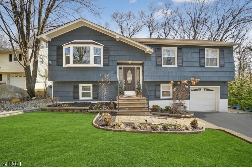 Welcome to Bloomingdale, New Jersey where comfort, space, and a connection to nature come together in this beautifully maintained three-bedroom bi-level home. From the moment you arrive, you'll notice the freshly painted exterior and new bay windows that enhance both curb appeal and natural light throughout.The main level offers a functional layout with granite countertops in the kitchen, three well-sized bedrooms, and a fully renovated bathroom (2025). The living spaces are warm and inviting, perfect for everyday living and entertaining.The ground level provides exceptional flexibility, featuring a spacious family room, a dedicated office, and a recreation room with an attached full bathroom and laundry area. This level walks out to a paver patio, creating an easy indoor-outdoor flow.Step outside to enjoy a brand-new deck overlooking a landscaped backyard complete with a tranquil pond and waterfall. Multiple outbuildings offer ideal space for hobbies, storage, or workshop use. The property backs to trees, providing privacy and a peaceful setting.Additional features include a one-car garage, attic storage, central air conditioning, and city water, sewer, and natural gas.Conveniently located near major highways, shopping, and dining, and just minutes to Norvin Green State Forest, parks, recreation programs, a dog park, pickleball courts, and more this home offers a well-rounded lifestyle in a desirable Bloomingdale location.