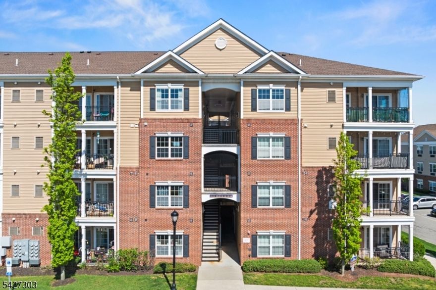 Welcome to this top-floor luxury condo in the desirable Celebration community of South Plainfield. Built in 2021, this well-kept unit offers a bright, open layout with updated vinyl flooring (2022) and a seamless living and dining area filled with natural light. Being on the top floor gives you added privacy along with higher ceilings that enhance the space. The kitchen is equipped with stainless steel appliances and ample cabinet space, offering solid functionality with room to personalize. The primary bedroom features a walk-in closet with built-in organizers and a private full bath with double vanity and shower. A second bedroom also includes closet organization and is serviced by a full guest bath with tub. Additional highlights include ceiling fans, in-unit stacked washer and dryer, sliding doors leading to a private balcony, and a separate storage closet next door. The building offers elevator access and well-maintained common areas, along with community amenities including a gym and pool. Conveniently located near major highways, shopping, and everyday essentials, this is a strong opportunity for low-maintenance living in a newer community.