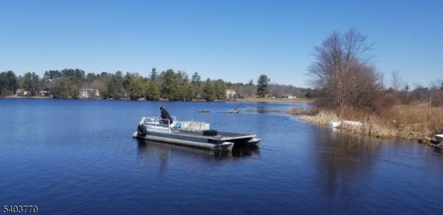 LAKEFRONT MULTI-FLOOR END UNIT! Experience the ultimate LAKEFRONT LIFESTYLE with this SPACIOUS LAKEFRONT CONDO offering nearly 2,500 square feet of living space that can easily accommodate an In-Law suite. It features 2 large bedrooms and 2 1/2 baths, with flexible living areas in a PRIME LOCATION within the Community. Enjoy stunning lake views from the formal dining room and the convenience of a CARPORT located just outside your door! This UNIT MAY ALSO BE COMBINED AS A SPECIAL 'PACKAGE DEAL' with the adjacent LAKEFRONT LOT AT 418 next door. Rest easy with a NEWER HIGH-TECH SEPTIC SYSTEM featuring electric-meter overflow monitoring. Ideal as a Year Round Residence, Weekend Retreat, or Investment Rental. COMMUNITY AMMENITIES: Lake Access, Pool, Beach, Playground, Basketball, Tennis Courts, and Dog Park! Also within the Community is the High Point Country Club 18-HOLE PUBLIC GOLF COURSE, RESTAURANT, PATIO, and LOUNGE. Loads of outdoor recreation nearby with High Point Monument State Park, the Appalachian Trail, Delaware River Rafting, and local Ski Resorts. Conveniently located near Routes 84,23, 206, and 6, with NJ Transit access to NYC. SPRING AND SUMMER ARE ALMOST HERE - DON'T MISS THIS OPPORTUNITY TO STEP INTO YOUR OWN PIECE OF LAKEFRONT PARADISE!!