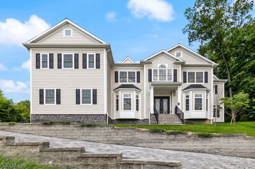 Discover unparalleled luxury in this newly constructed custom-built Colonial home, located in the prestigious Upper Saddle River. Spanning over 5,500 sqft, this magnificent residence features 5 bedrooms and 5.5 baths. Upon entry, the elegant double doors open to a breathtaking 2-story grand foyer with a curved stairwell, setting the tone for the home's opulence.The first floor offers an array of spaces including a formal dining room, a living room, a private office, and an impressive suite with a full bath. At the heart of this home is the gourmet kitchen, outfitted with top-of-the-line appliances and seamlessly flowing into the grand room, where a fireplace and custom built-ins create a warm and inviting atmosphere. Natural light floods the interior, highlighting the exquisite outdoor paver patio. A convenient butler's nook enhances the ease of entertaining.Access the second floor via either of the two stairwells, leading to the primary suite complete with a spa-like bath, as well as three additional bedrooms, each with its own full bath. The massive finished basement includes a full bath and provides versatile space for various needs. The home also features a practical mud area and a spacious walk-in pantry, adding to its functionality. With a 3-car garage and numerous luxury features, this exceptional home epitomizes high-end living in Upper Saddle River.