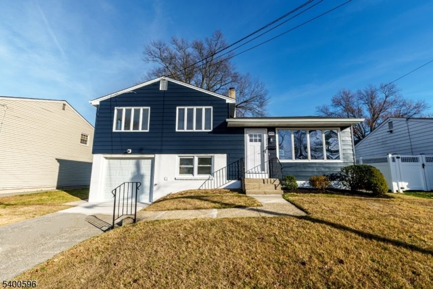 Welcome to this move-in ready split-level home, offering a comfortable layout and ready to make it your own. The main floor features an open-concept design connecting the living room, kitchen, and dining area. The second floor includes three bedrooms and a full bath. On the ground level, you'll find a versatile leisure room, a powder room with laundry hook-up, and access to the built-in garage. The backyard is spacious and inviting - perfect for outdoor gatherings, gardening, or simply relaxing. To help visualize this home's floor plan and to highlight its potential, photos are virtually enhanced and/or virtual furnishings may have been added to the photos found in this listing. The property is being sold 'as-is'. There are no seller disclosures nor representations. The buyer is responsible for obtaining the CCO, smoke cert. and/or all inspections required to close.