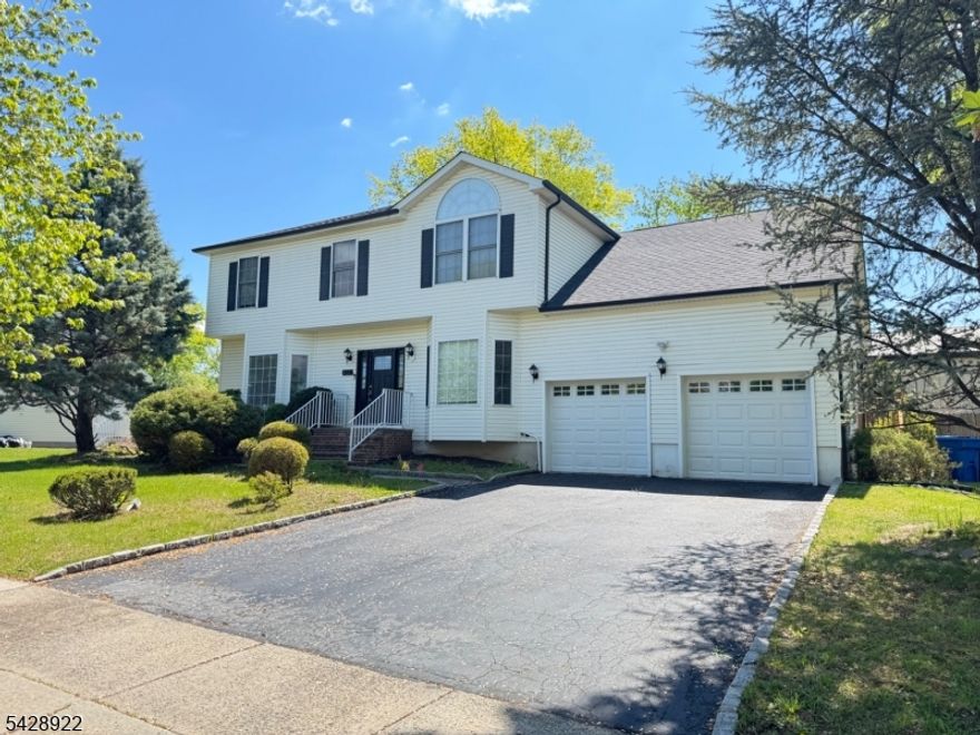 This bright and beautifully maintained Colonial home is remodeled including kitchen with modern appliances, bathrooms, flooring, paint and stunning light fixtures. It offers a spacious layout with neutral decor throughout. The welcoming foyer leads to a formal living room on one side and a dining room on the other, creating a comfortable flow for everyday living and entertaining. The rear of the home features a cozy family room with a wood-burning fireplace, an eat-in kitchen with modern appliances and ample storage, powder room, and convenient first-floor laundry room. The second floor offers 4 generously sized bedrooms and 2 full bathrooms. The primary suite includes a walk-in closet, additional extra storage room and a private en-suite bath with a soaking tub and stall shower. The finished basement provides additional entertainment space along with a full bathroom with jacuzzi. Enjoy the peaceful backyard setting complete with a patio, perfect for relaxing or entertaining outdoors. Additional upgrades include a new roof, arch window blinds and white closet organizer in master walk in closet. Conveniently located in Piscataway close to major highways, shopping, dining and Rutgers University.