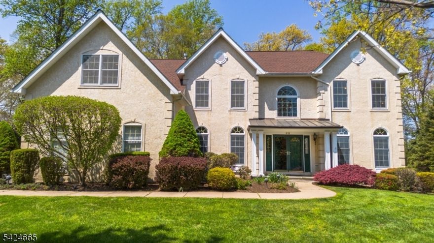 Overlooking the NJ National Golf Course, this exquisite 5 BR, 3.1 Bath colonial in the sought-after Independence Hill captures the essence of elegance & comfort! The expanded two-story foyer, the oversized kitchen with center island & breakfast area as well as the two-story family room with gas fireplace, and the adjacent morning room with abundant natural light, all add to the charm of this property. Hardwood floors throughout the first floor, hallway, master suite including 2 walk-in closets & sitting room. All other 4 bedrooms have new carpeting (2026). The list of improvements includes new roof & skylights (2022), new HVAC units (2019), new water heater (2018), refinished H/W floors of the first level (2022), painting of the entire interior (2024) and addition of the portico (2004). The spacious walk-out basement offers space for additional build-out. The expansive & private deck offers a panoramic view of professionally landscaped lot & the golf course. The over-sized 3-car garage has 3 newer door openers. built-in security system & central Vac. Basking Ridge is known for its top-rated school system!  Easy access to I-78 & I-287!
