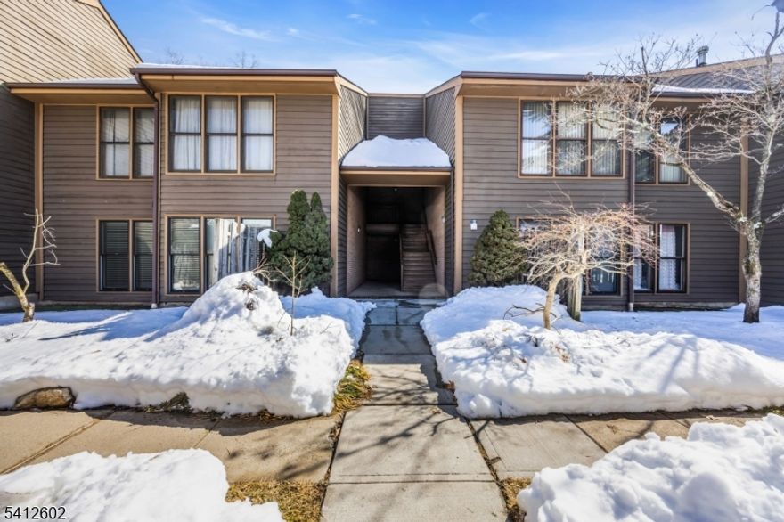 Welcome to this beautifully updated 1st-floor condo in the desirable Timberline community. This freshly painted unit features newer laminate flooring & extensive recessed lighting throughout, offering a bright, modern feel from the moment you enter. The spacious living room includes a cozy wood-burning fireplace & opens seamlessly to the dining area. The adjacent kitchen offers updated appliances & ample cabinet space. The generously sized primary suite includes two large closets & a private en-suite bath. A second bedroom & full bath provide added flexibility. Enjoy in-unit laundry & your own covered patio backing to community grounds & tennis courts. Additional highlights include central air & heat, as well as a private 1-car garage. Conveniently located near shopping, dining, parks & major roadways. Don't miss this one!