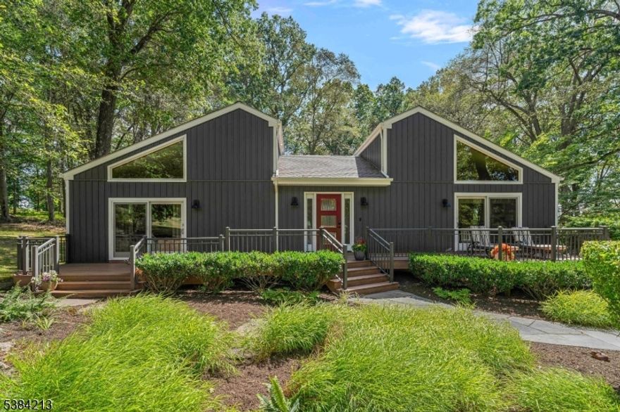 Beautiful contemporary home on 2+ acres of a wooded lot only 1/4 mile to entrance of Round Valley Reservoir and within 2 miles of historic downtown clinton.An abundance of windows and skylights provide natural light.  Main level of home is a semi- open floor plan including LR, DR, Family Room with fireplace, Kitchen with adjoining eating area, Primary Bedroom with walk in closets and attached full bath, 2 additional bedrooms with access to a Full Hall Bathroom, all rooms are large and surround a peaceful atrium. The Atrium has a fresh water pond and garden area. Great place to meditate or read while listening to the water flowing. The lower level provides an in-law ensuite with a full bath, LR area, Laundry Room, ass well as access to a large Storage/Work Room, Utility Room, oversized garage and heated inground pool. There are multiple decks to enjoy the great outdoors. The front deck is the full length of the home and a raised deck at the back of the house loverlooks the pool. Landscaping is professionally maintained.  This home is a true gem! The current owners had the home built and have lived in it since.