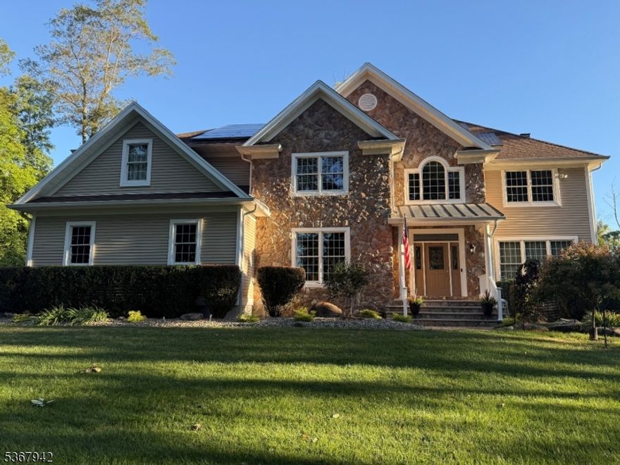 20 year-young beautifully built custom home with distinctive floor plan and clever features that set it apart from the rest. Fine details throughout including custom millwork, tray ceilings, wood and tile flooring, recessed lighting, open 2nd floor with bridge and den overlooking light-filled 2-story family room w/floor to ceiling windows and stone fireplace, large kitchen with cherry cabinets, granite counter tops, stainless steel appliances, bi-level center island w/separate prep space and bar for seating, desk area w/filing drawers, bumped out breakfast nook overlooks tree-lined yard, primary suite w/sitting area and full bath; 3 additional bedrooms, 1 with en suite bath; walk-up attic could be finished for added living space; unfinished basement w/2nd staircase to garage/outside access. Oversized 3 car garage with work area and sink. Private setting on cul de sac. Public utilities, gutter guards, paver walkways, fully fenced yard, whole house automatic generator, newer hot water heater and so much more.  Cucinella elementary and West Morris Central High School.