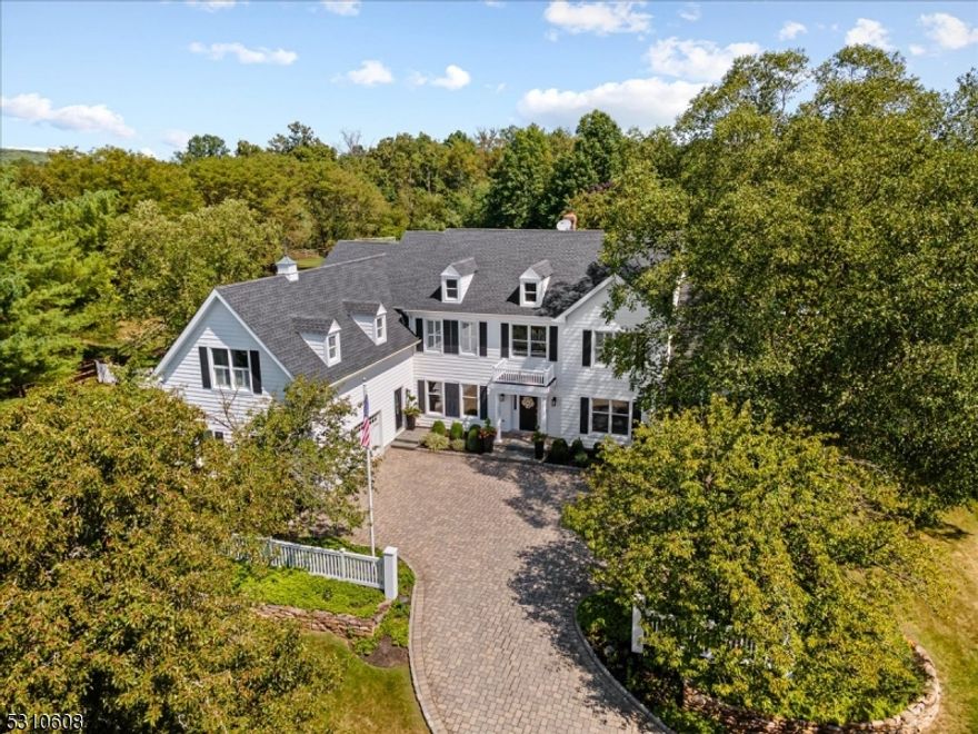 This renovated Bedens Brook Estates home is situated on one of the most desirable lots in the neighborhood, with a New England ambiance outside and a fresh contemporary feel inside. The resort-style grounds feature a stunning pool, putting green, basketball court, pavilion, and large pool shed. Moving inside, a newly customized mudroom opens into the sparkling renovated kitchen and continues to the open floorplan. Spread out in the family room with two stories of windows overlooking the gorgeous backyard, and cozy up to the gas fireplace. The formal dining room is well-appointed for every holiday celebration. Just past the home office, the renovated conservatory opens to the pool area with endless views. Moving upstairs, the master suite with its cathedral ceiling gives an incredible sense of space and leads to the newly renovated master bath. Two guest bedrooms are Jack and Jill suites and the fourth and fifth are en-suites with separate renovated full baths.The large finished basement boasts a gym, media room, office, cedar closet, workshop, and full bath.  The large finished basement boasts a gym, media room, office, cedar closet, workshop, and full bath. The gracious and expansive covered deck, is easily accessible from the kitchen and family room. Some of the upgrades include renovated master bath (2021) and guest baths (2022), renovated kitchen (2022), renovated conservatory (2021), 2 AC units (2022/2024), 2 water heaters (2020), and roof (2020). Montgomery schools.