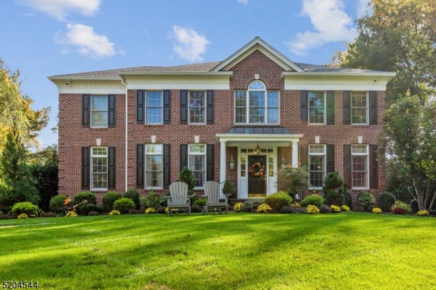 Welcome to this exquisite luxury colonial, situated on a spacious and lush property that is perfect for luxurious living. This stunning home boasts an impressive design, featuring classic colonial architecture with modern touches that add to the grandeur of this magnificent estate. As you step inside, you will be greeted by a grand foyer with high ceilings and a sweeping staircase that leads to the upper levels. The first floor of this home features a spacious living room, perfect for hosting guests, as well as a formal dining room that can accommodate large gatherings. As an added bonus you will also find a first floor bedroom. he gourmet kitchen is a chef's dream, with custom cabinetry, top-of-the-line appliances, with ample counter space for meal preparation. The kitchen also opens up to a family room, complete with a fireplace and plenty of natural light. The upper levels of this home offer six spacious bedrooms, each with its own en-suite bathroom and walk-in closet. The master suite is particularly impressive, featuring a spacious bedroom, an office area, a walk-in closet, and a luxurious bathroom with a soaking tub and separate shower.