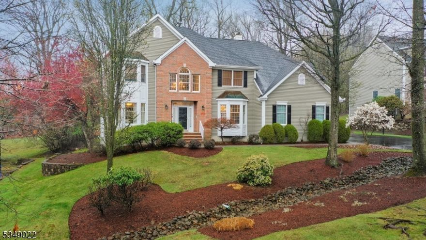 Impeccably maintained and move-in ready, this elegant home offers a warm, open floor plan with a comfortable, welcoming feel. Rich hardwood floors run throughout, while chair rail and detailed moldings add a refined touch. The inviting family room features cathedral ceilings and soaring palatial windows that bathe the space in natural light and frame the fireplace centerpiece. The primary suite is a true retreat, boasting vaulted ceilings and a two-sided fireplace that connects the serene sitting area to the sleeping quarters. A spacious walk-in closet, separate storage closet, and updated en suite bath enhance the luxury feel. Additional bathrooms are beautifully updated as well. Set on a large wooded lot, the property combines natural privacy with neighborhood charm. Enjoy access to top-tier amenities including a clubhouse, swimming pools, tennis courts, and playgrounds. Located within a nationally ranked school district and just minutes from Routes 78, 287, 202, and 206 this home offers the perfect balance of tranquility, convenience, and community.