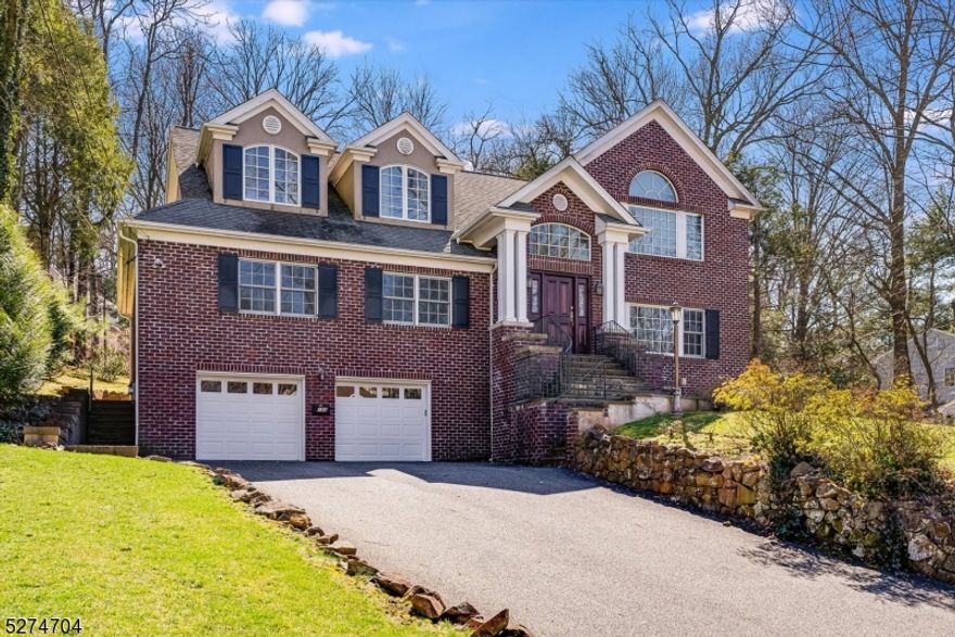 MAGNIFICENT move-in ready, renovated 6 Bedroom, 5.1 Bathroom Colonial settled high on a hill on a quiet Summit street just minutes from town, best schools, shopping, and NYC commute. Easy, open flow and gorgeous hardwood floors throughout entire first and second level. Two-story Entry Foyer radiates with natural sunlight and vaulted ceiling. Striking Chef's Eat-In Kitchen boasts cherry wood cabinetry, granite countertops, large island, breakfast bar with pendant lighting, stainless steel appliances (Sub-Zero, Viking, KitchenAid), 2 double sinks, and sun-drenched dining area with double French door to bluestone patio. Kitchen opens to spacious and sunny Family Room with 2-story vaulted ceiling. 2 Bedrooms, including 1 En-Suite, Full Hall Bath, and multiple abundant closets complete First Level. Second Level Primary Bedroom shines with walk-in closets and Full Bath with quartz double vanity, jacuzzi bathtub, and attractive glass door shower with marble surround. Three additional Bedrooms, including the "Princess Suite  with En-Suite Bath, are all big and bright with great closets. Carpeted Lower Level Recreation Room offers nice natural light, plus Half Bath, Laundry Room, and substantial storage space. Backyard is wooded and semi-private with generous patio, ideal for indoor/outdoor entertaining. 180 Blackburn is your one stop shop for easy living in one of the most charming neighborhoods Summit has to offer. Move in today!