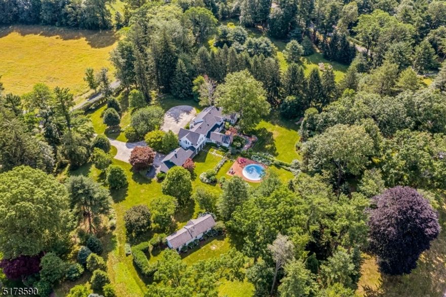 Stunning custom home privately set on 7 +/- acres in sought after mountain location. Exceptional grounds with fabulous gardens, terraces, pool and a charming 1 Bedroom cottage with living Room, kitchen and full bath.