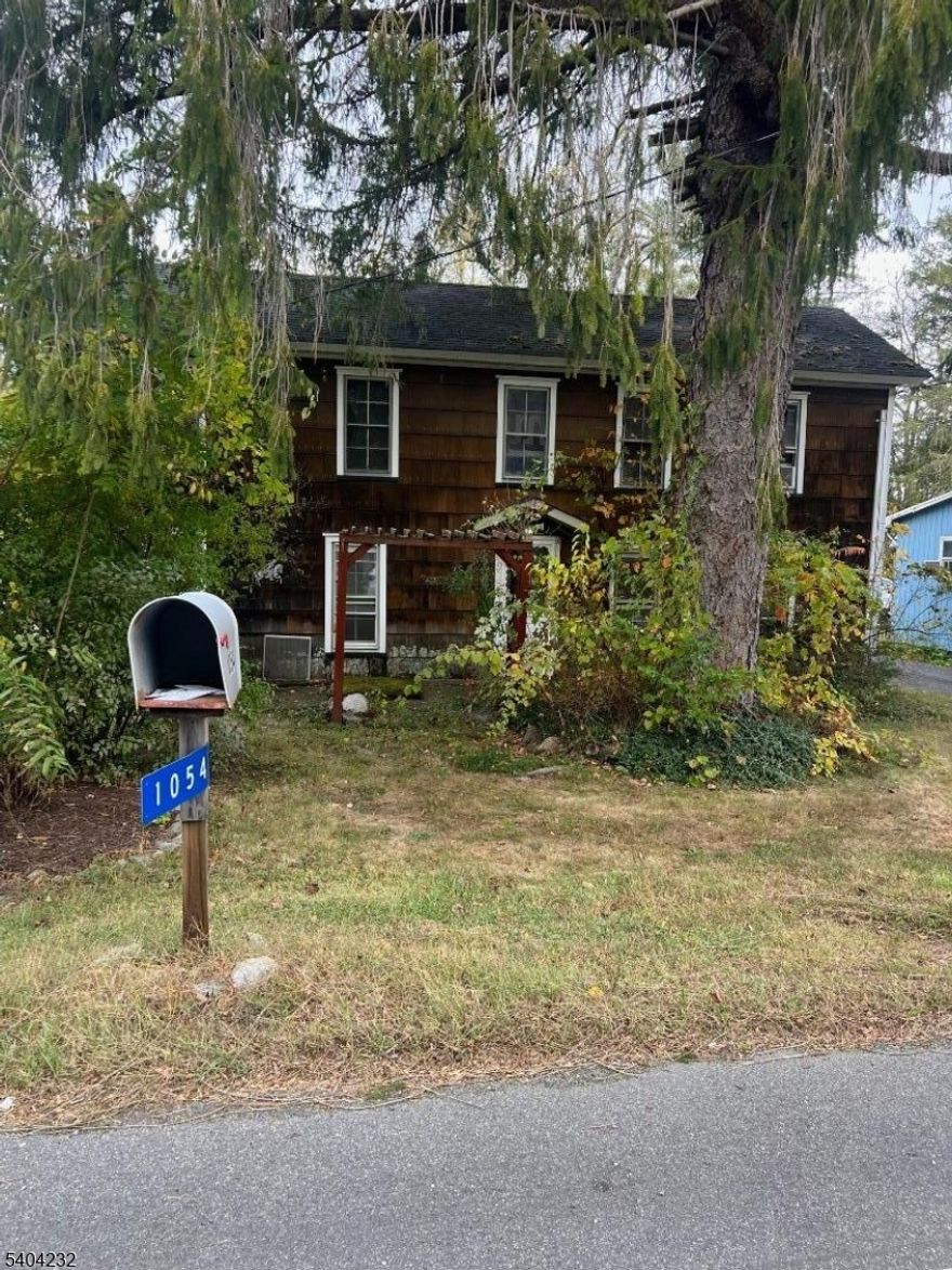 Step into this inviting 3 bedroom, home full of warmth and character. Built in 1862, this vintage gem features classic wood shingle siding, a welcoming front entry, and plenty of parking on its spacious .53-acre lot. Inside, you'll find a comfortable layout with a large living room, dining room, and upstairs three bedrooms.The property also includes a large detached garage, perfect for storage, a workshop, or additional income potential. Located directly on State Route 94, this home offers unbeatable accessibility, ideal for commuters or small business owners seeking visibility and convenience. Currently occupied by a long-term tenant who wishes to remain, this is a turnkey investment opportunity with steady rental income from day one. Whether you're looking to expand your portfolio or own a charming piece of history, this property checks all the boxes.