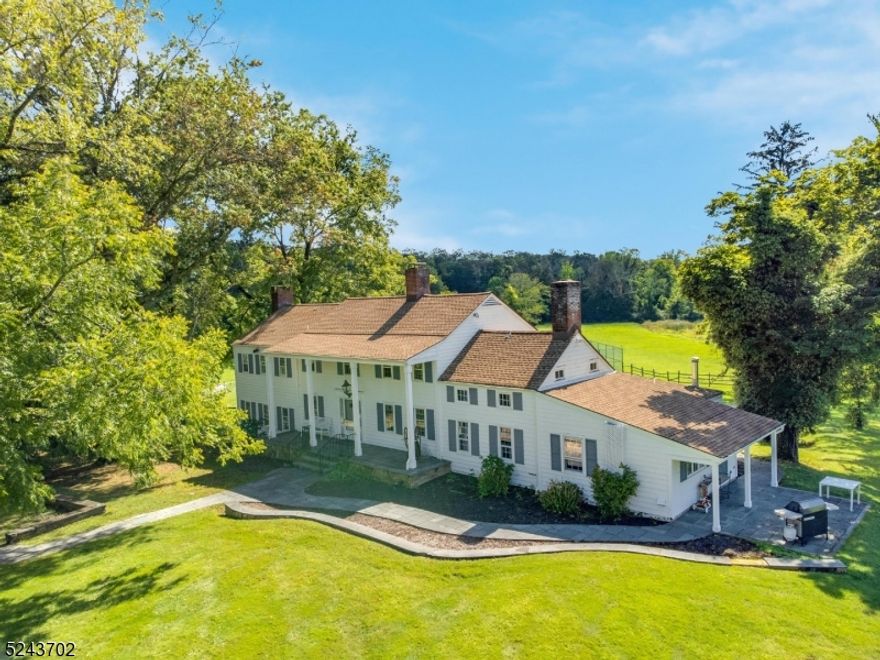 Partial antique home with modern conveniences set on an incredible 15+ farm assessed open and usable acres in the prestigious Far Hills area of Chester Township, this spacious colonial is waiting for it's new owner to bring it back to magnificent!  Original portion of home has many antique and charming details, including built-in bookshelves, pumpkin pine flooring and multiple fireplaces.  Property includes in-ground pool, tennis court, bluestone patios, stream, pond, 4 stall barn (needs work), fenced pastures, Morton style building with 3 bays, heat and electric, additional 2 bedroom carriage house on property with 20+ year tenant on month to month lease.  Home and buildings sold strictly as-is with contents included.  Shared septic with home and cottage needs to be most likely replaced with individual septic systems. Located just 2 miles from the center of downtown Chester, you're minutes away from NJ Transit Gladstone train station, fantastic shopping and dining, world class golf (USGA) and equestrian facilities (Private and USET), and award-winning public and private schools. This is a one-of-a-kind property ideal for a primary residence or second home.  Far Hills 07931 zip code.