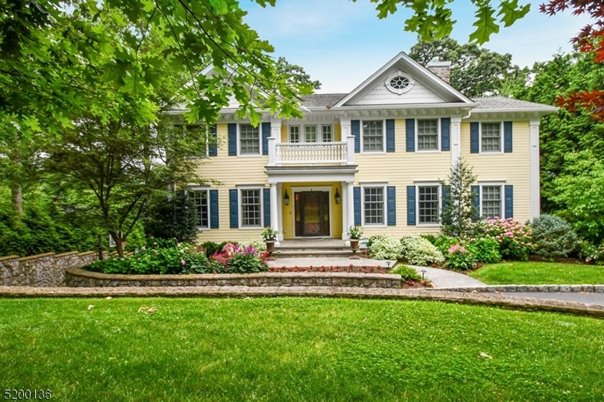 Stunning Center Hall Colonial in Coveted Woodland Park Cul De Sac Location.  Newly built in 2006 by Menza and Beissel with quality upgrades and improvements since.  Exceptional Architectural details include high ceilings, grand scale rooms, wide staircases, custom millwork and cabinetry.  Open concept kitchen and family room, private home office, beautiful formal rooms, elegant primary suite and large bedrooms. Walk out lower level with large media and recreation space (original home design was for 5th bedroom), full bath, attached 3 car garage and mud room.  Home Generator, heated driveway, finished garage with new flooring and organization system, new security system. Level rear yard with retaining wall, privacy plantings great for play and private leisure time.  Unbelievable Sunset Views!  Location, lifestyle and luxury!