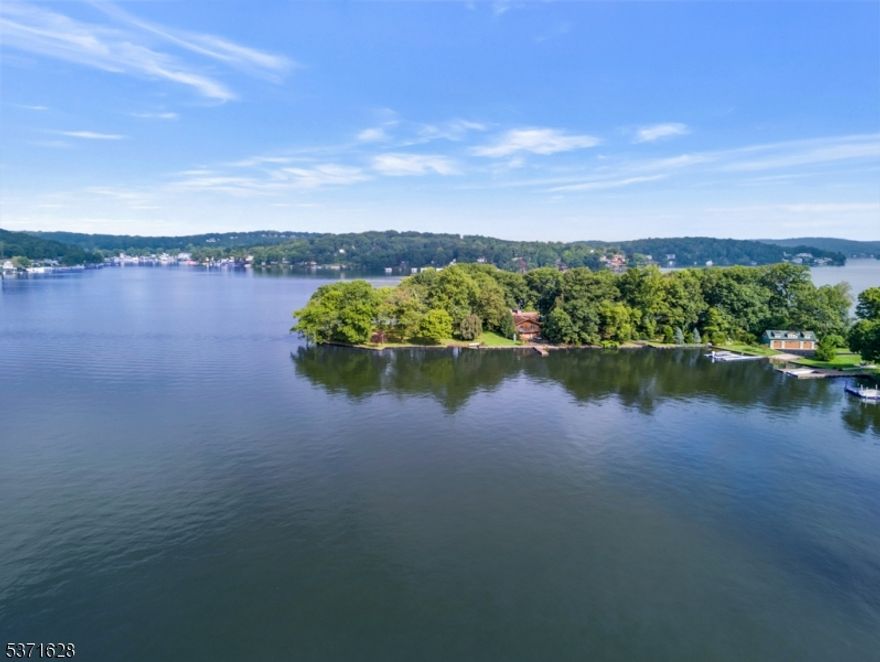 Chestnut Point - Rare Lakefront Opportunity on Lake Hopatcong.  Welcome to one of the most coveted lakefront properties! This stunning offering includes three waterfront lots totaling 3.75 acres (2.23, 0.76, and 0.68 acres), providing an exceptional opportunity to create your dream estate or a premier waterfront retreat.  The properties currently feature: a ranch-style home (4087 sq ft) , a detached oversized two-car garage, and a one-bedroom cottage (940 sq ft).  Whether you're looking to renovate or build new this is a truly unique opportunity to own a piece of paradise on New Jersey's largest lake. Enjoy boating, fishing, swimming, and sunsets right from your own backyard.  Don't miss this rare gem in an unbeatable location.
