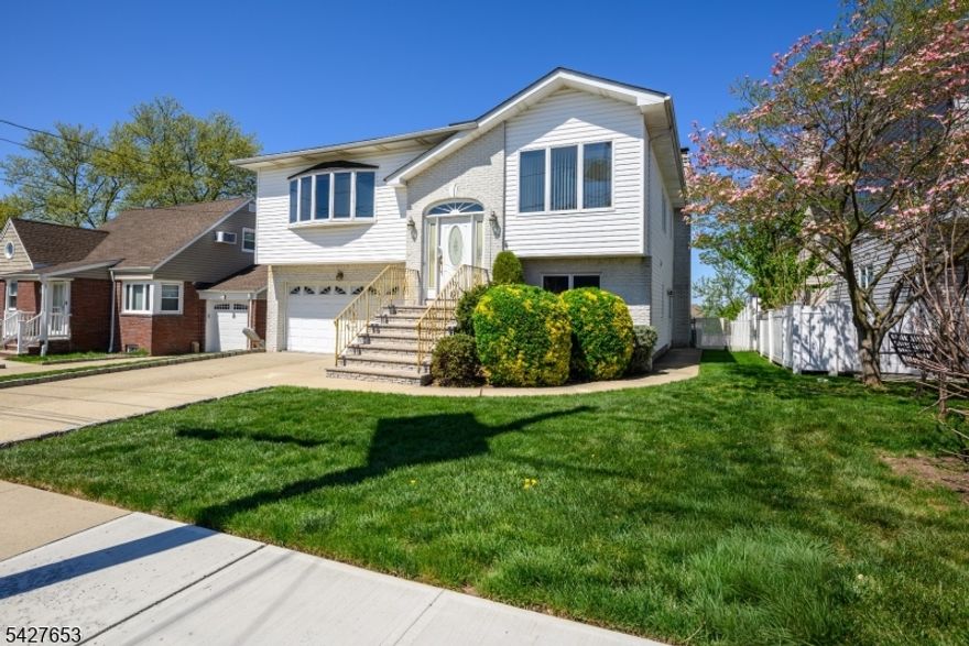 Welcome to 147 11th Street, a well-appointed bi-level home nestled in the heart of Wood Ridge, NJ. offering 5 bedrooms, 3 full baths, and approximately 2,700 square feet of living space, this home sits on a well-maintained 50x100 lot with an attached two-car garage. The main level is thoughtfully laid out with a welcoming living room, formal dining room, and an eat-in kitchen ideal for everyday living and entertaining alike. Three bedrooms and two full baths round out this floor, including a primary suite for added comfort and privacy. The ground level expands your options significantly. Two additional bedrooms, a full bath, a second living area, dedicated laundry, and a utility room provide the kind of flexibility that's hard to find. With direct exterior and garage access, this home has defined separate living areas, suitable a home office setup or simply extra space to spread out. Situated in desirable Wood Ridge, residents enjoy a welcoming community with convenient access to major highways, NJ Transit rail service, and an array of local shops and dining.